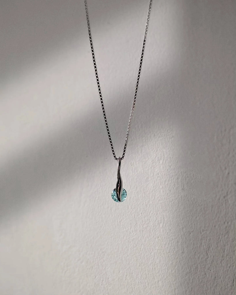The Seventh Sea cremation pendants, handcrafted memorial jewelry made from ashes and glass, perfect for honoring a loved one with a unique and lasting keepsake.